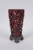 A Chinese carved soapstone vase with pierced grape vine decoration, AF repair, 20cm high