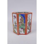 A Chinese shaped porcelain brush pot with famille vert decorative panels depicting figures and