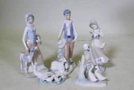 A Lladro figure of a girl with doves, 21cm high, a Lladro and Nao group of geese and a pair of