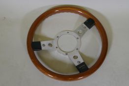 A Mountney chrome and wood car steering wheel, 34cm diameter