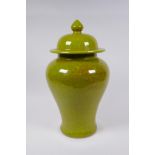 A Chinese lime green crackleware Meiping jar and cover, 35cm high