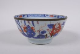 An C18th Chinese Qianlong porcelain bowl with a metal rim and landscape decorated in the Chinese