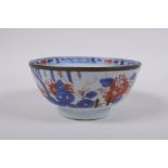 An C18th Chinese Qianlong porcelain bowl with a metal rim and landscape decorated in the Chinese