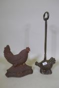 A Victorian cast iron doorstop in the form of a hen, and another, 55cm high