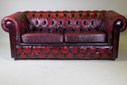 A button back leather Chesterfield sofa bed, 190cm high