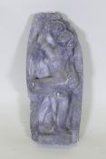 A painted plaster cast after an antique Indian carving of an embracing couple, 44cm long