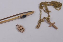An 18ct gold bar brooch set with a cabochon sapphire and diamond, 2.7g gross, a 9ct gold crucifix