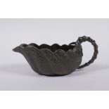 A Japanese bronze bamboo and leaf shaped cup/pourer, signed to base, 15cm long