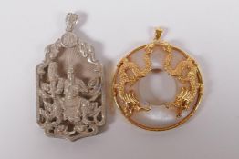 A Chinese gilt metal and glass pendant with dragon decoration, and a white metal pendant with