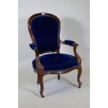 A pair of Victorian mahogany show frame arm chairs with faux bois grain painted decoration, raised