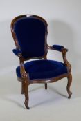 A pair of Victorian mahogany show frame arm chairs with faux bois grain painted decoration, raised