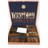 A Thai bronze and rosewood twelve place cutlery set in wood canteen, appears unused