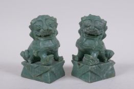 A pair of Chinese carved green soapstone temple lions, 10cm high