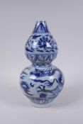 A Chinese blue and white porcelain double gourd vase with dragon and flower decoration, 26cm high