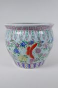 A Chinese famille rose enamelled porcelain jardiniere, decorated with butterflies amongst flowers,