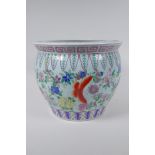 A Chinese famille rose enamelled porcelain jardiniere, decorated with butterflies amongst flowers,