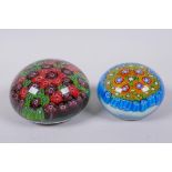 A millefiori glass paperweight, and another smaller, largest 10cm diameter