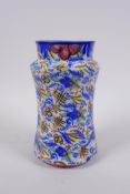 An antique continental majolica vase of waisted form, 20cm high