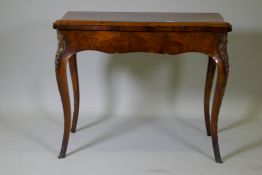 A C19th figured walnut serpentine front card table, with brass mounts, 92 x 46 x 75cm