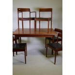 A mid century Danish teak dining table and six chairs (4+2) by Norgaards Mobelfabrik, the table with