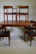 A mid century Danish teak dining table and six chairs (4+2) by Norgaards Mobelfabrik, the table with