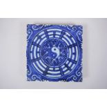 A Chinese blue and white porcelain temple tile with Yin Yang decoration, 19 x 19cm