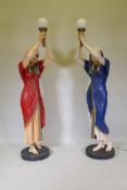 A pair of life size composition torchere lamps in the form of Egyptian maidens, 184cm high