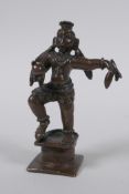 An antique Indian bronze figure of a dancing figure, 10cm high