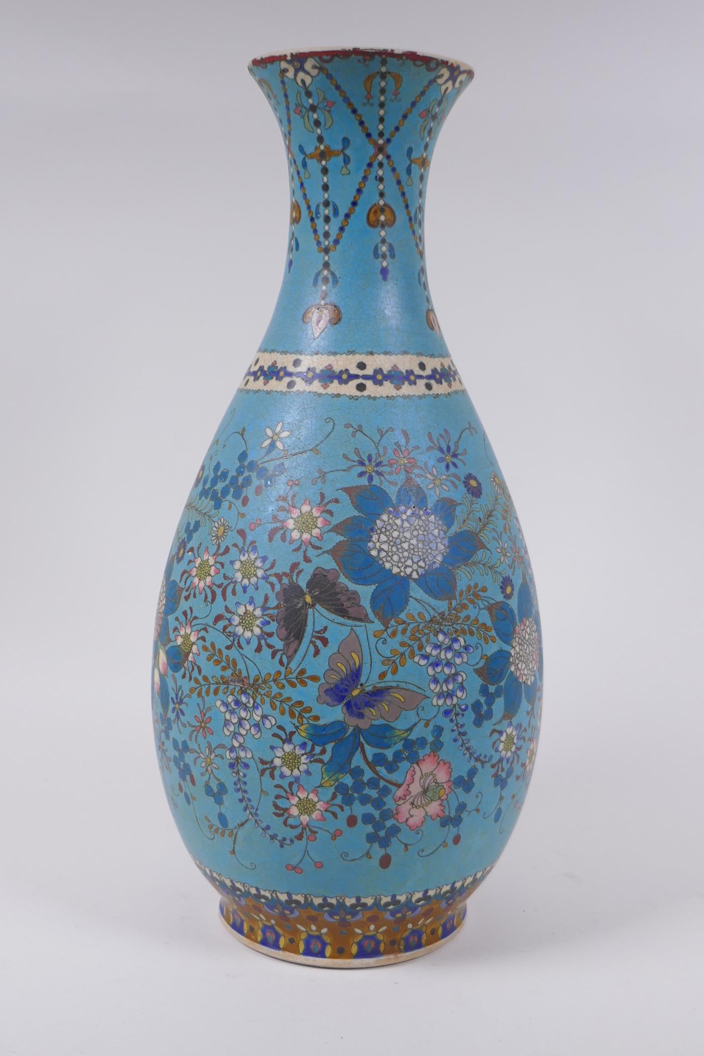 A Japanese Meiji period cloisonne on porcelain pear shaped vase with floral and butterfly