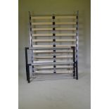 A contemporary silver painted metal double bed frame, base 141 x 191cm
