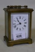 A brass cased glass carriage clock with enamel dial, 12cm high