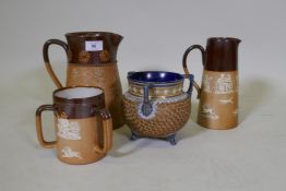 A Royal Doulton stoneware jug, AF, a hunting jug and tyg, and another, largest 22cm high