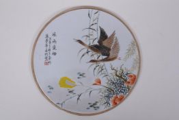 A Chinese Republic style porcelain panel decorated with waterfowl and flora, 27cm diameter