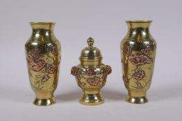 A pair of Japanese brass spill vases with copper inlaid bird and prunus blossom decoration, and a