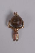A 9ct gold touch wud charm in the form of a woman, reg.622322?, 2.5cm long
