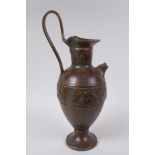 A solid bronze ewer with cast Greco Roman style decoration, 35cm high