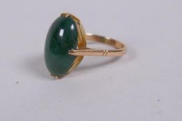 A 14ct yellow gold ring set with a green jade stone, 4g gross, marked Liberty & Co
