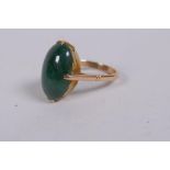 A 14ct yellow gold ring set with a green jade stone, 4g gross, marked Liberty & Co