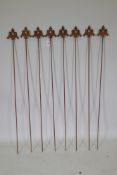 A set of eight cast iron gothic style plant stakes with fleur de lis, 108cm high