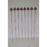 A set of eight cast iron gothic style plant stakes with fleur de lis, 108cm high