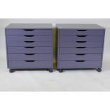 A pair of contemporary painted chests/filing cabinets with six graduated drawers, raised on castor