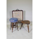 A Victorian beech wood stool, raised on sabre supports, 55cm high, another carved with an heraldic