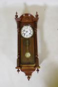 A mahogany cased Vienna wall clock, movement striking on a gong, 30 x 92cm