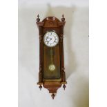 A mahogany cased Vienna wall clock, movement striking on a gong, 30 x 92cm