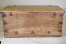 An antique colonial teak coffer with bronze mounts and carrying handles, 146 x 70 x 68cm