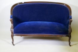 A Victorian mahogany settee/canape, with faux bois grain painted decoration, bow shaped front,