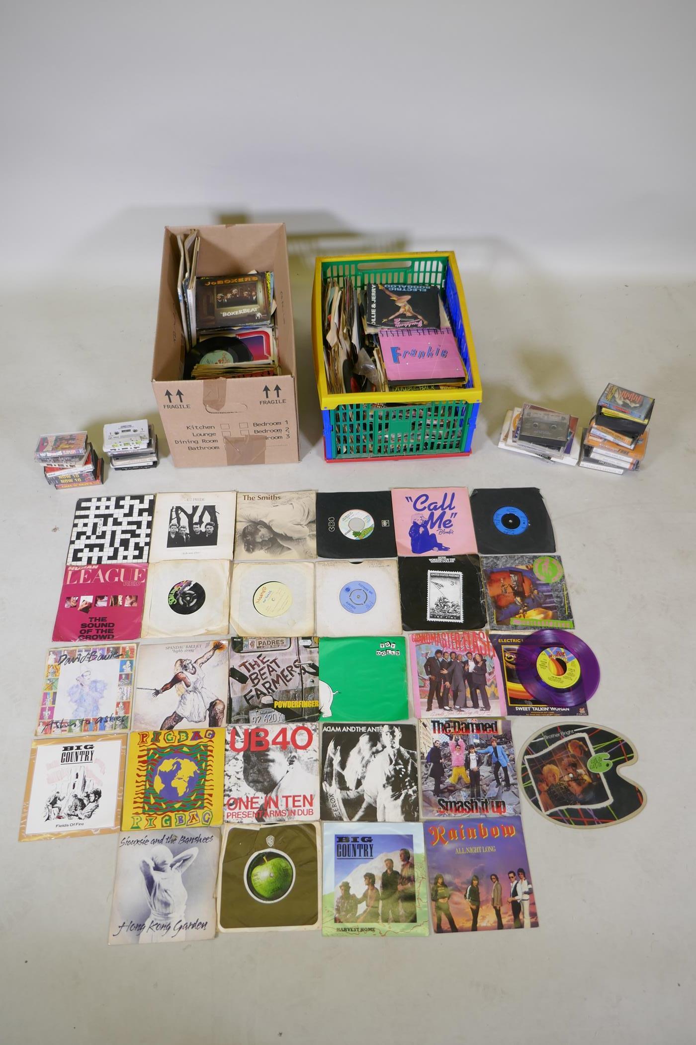 A large quantity of vintage 7" singles and cassette tapes, including The Smiths, Sparks, Blondie,