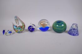 Two art glass paper weights, three animal shaped glass paper weights and an art glass stem vase,