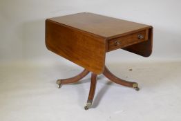 A George III mahogany pembroke table with single end drawer, raised on a turned column and splay