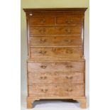 A Georgian mahogany chest on chest, the upper section with dentil cornice and canted and reeded